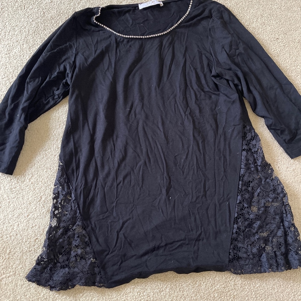 Ladies top with rhinestone collar.